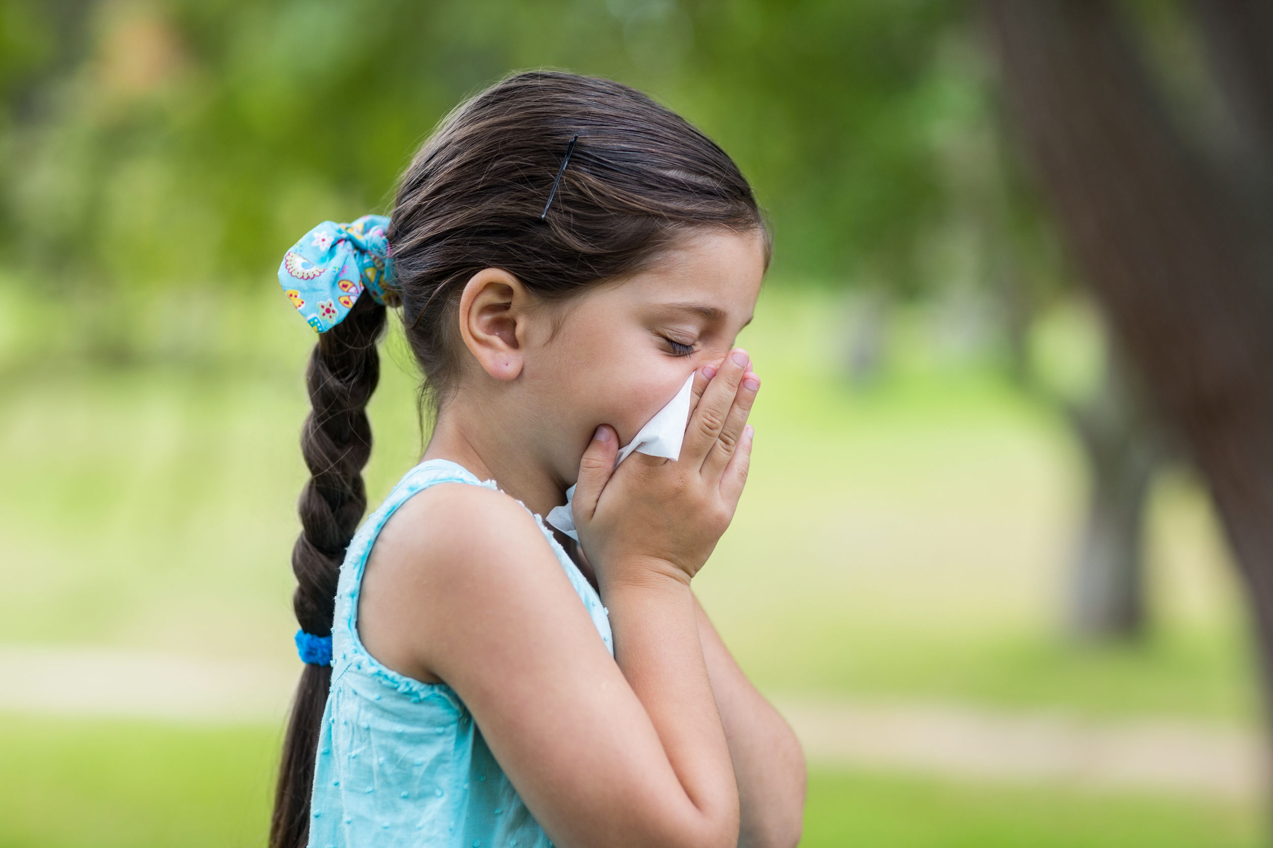 42672191 – little girl blowing his nose on a sunny day