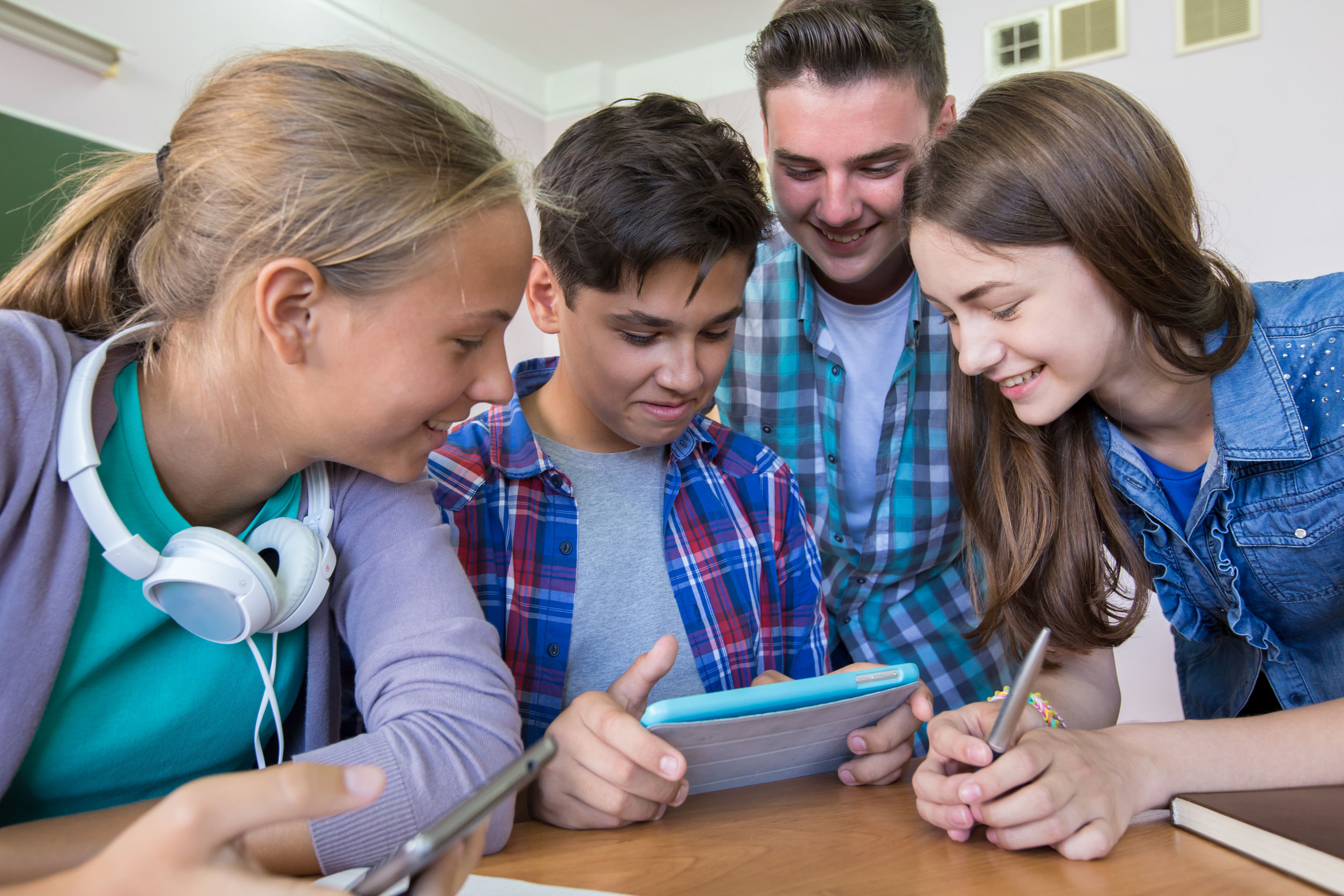 45903114 – group of young students studying in the classroom with tablet